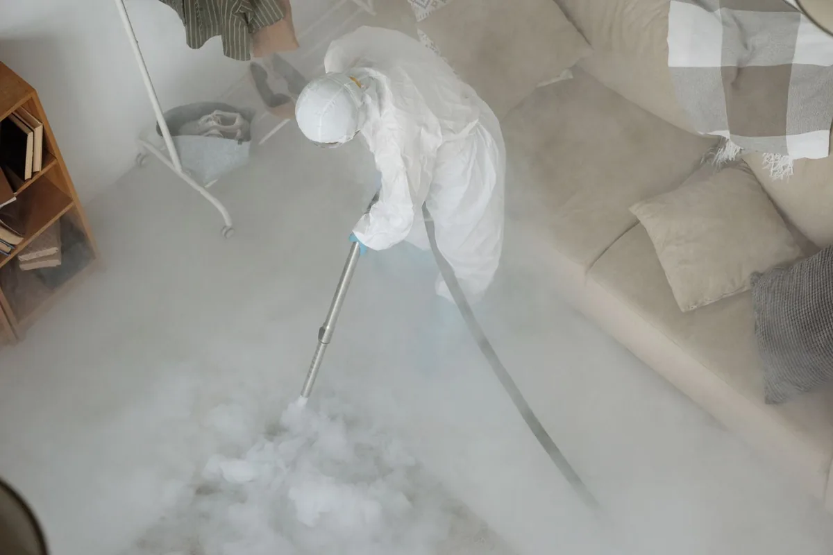 Biohazard cleanup technician in protective equipment, Medford Lakes, NJ